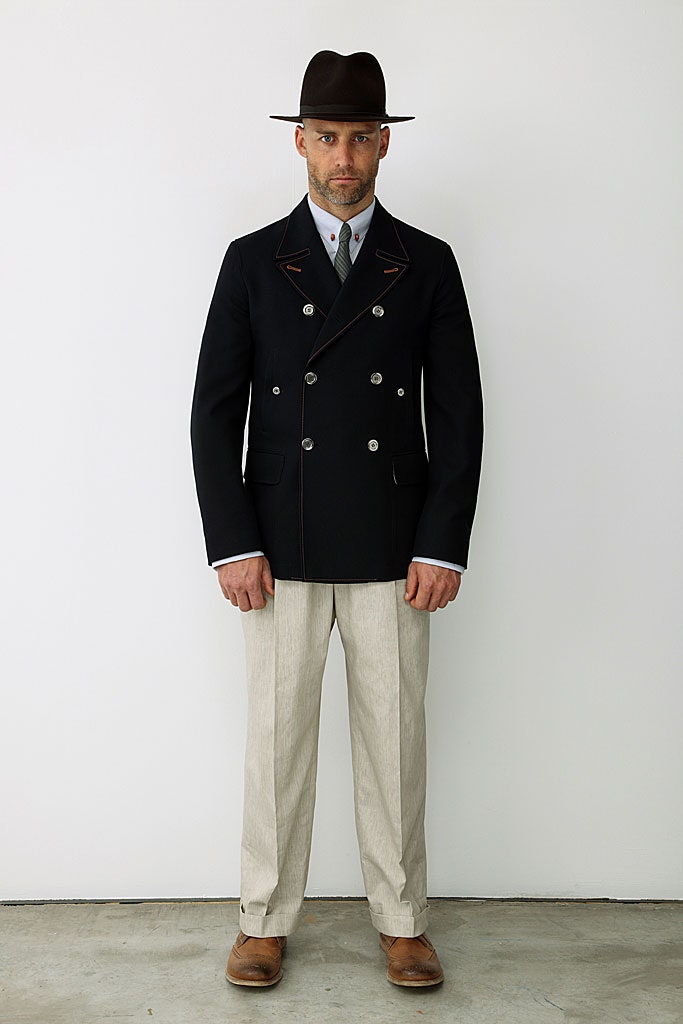 black tailored blazer with beige pants