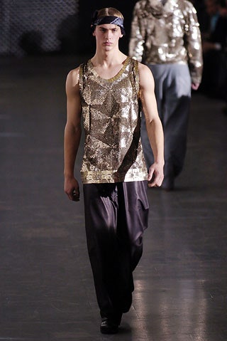 gold sequin tank-top with black pants