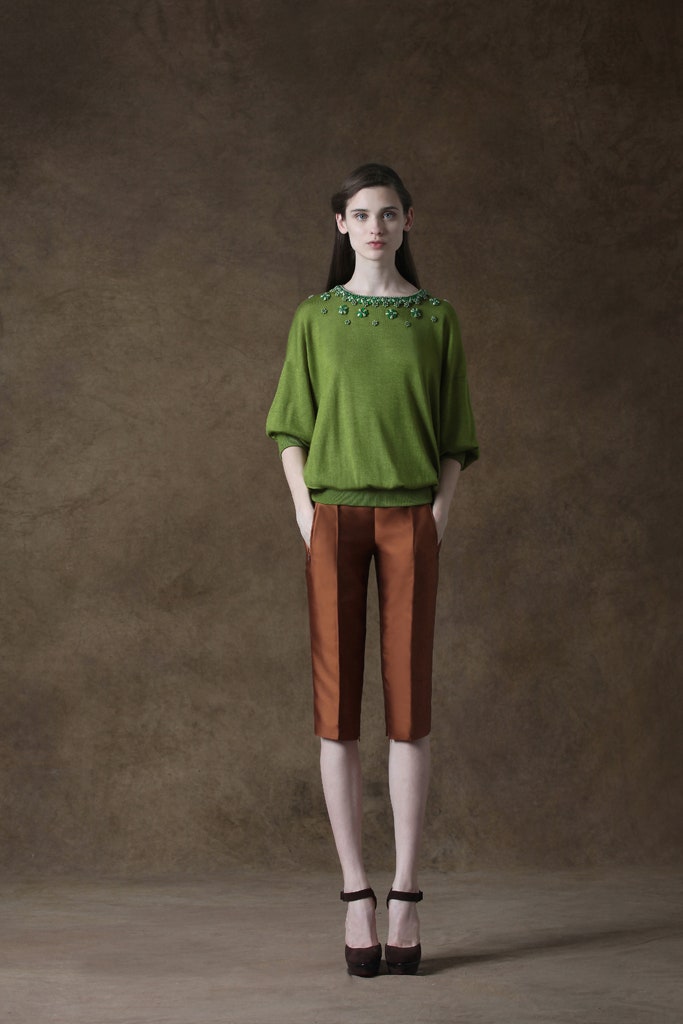 green embroidered top with brown pants