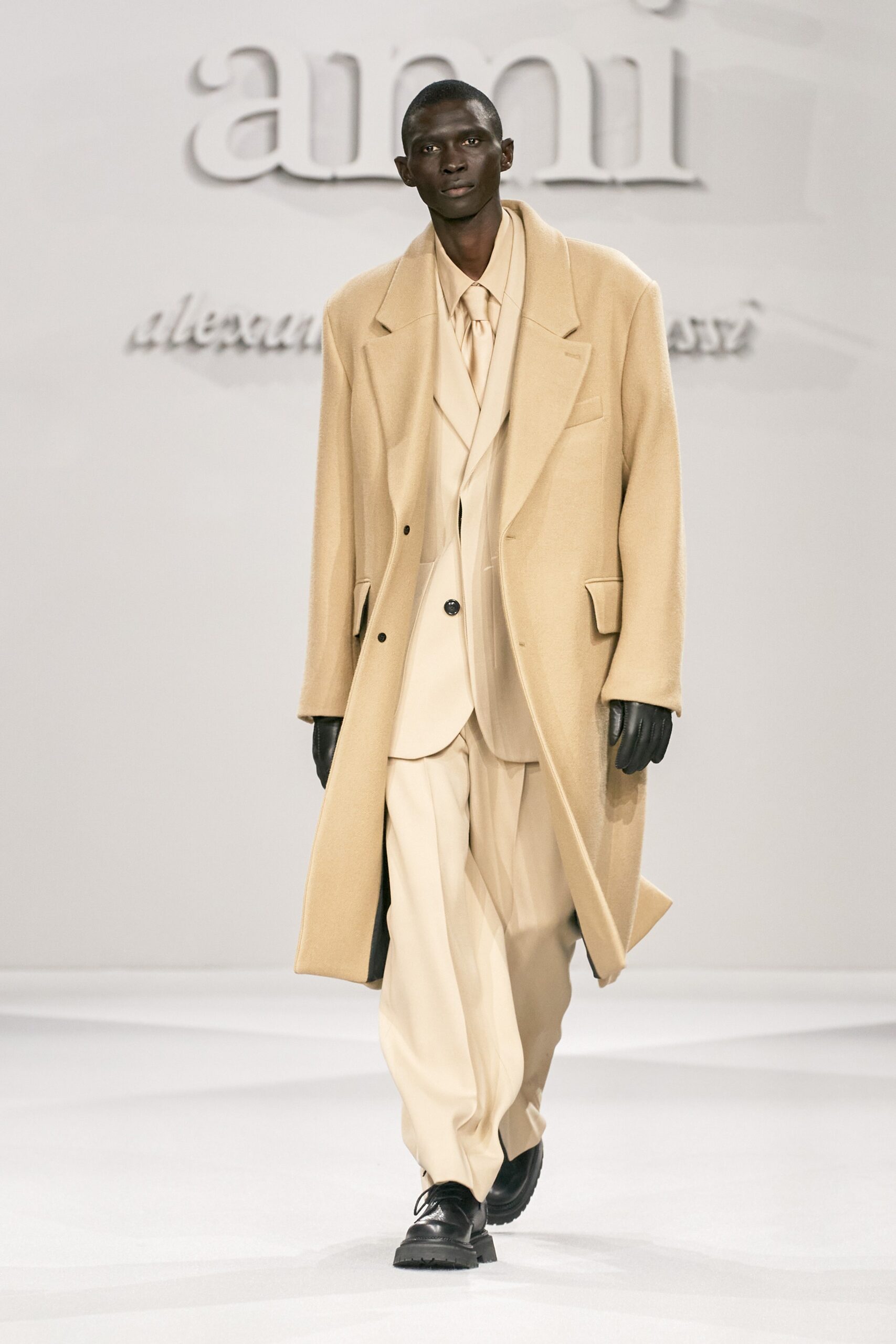 beige wool coat with cream suit