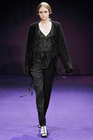 black sequined top and tailored pants