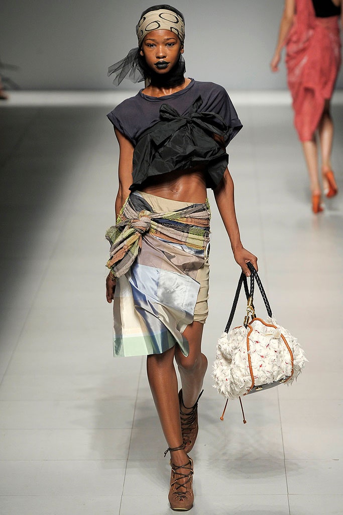 black fitted cropped top with layered skirt