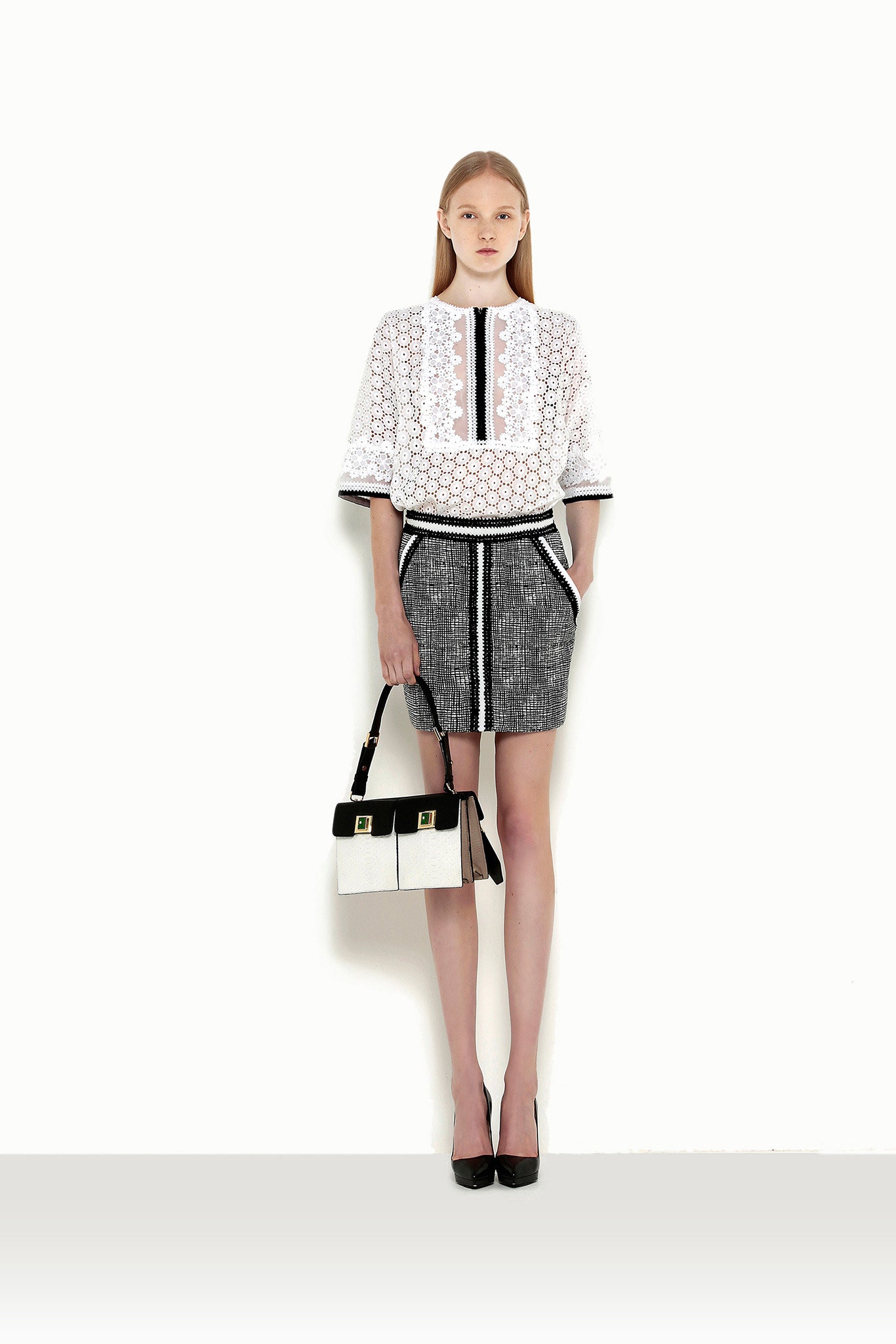 white embroidered top with black skirt