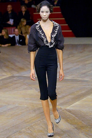 black silk ruffled top with fitted pants
