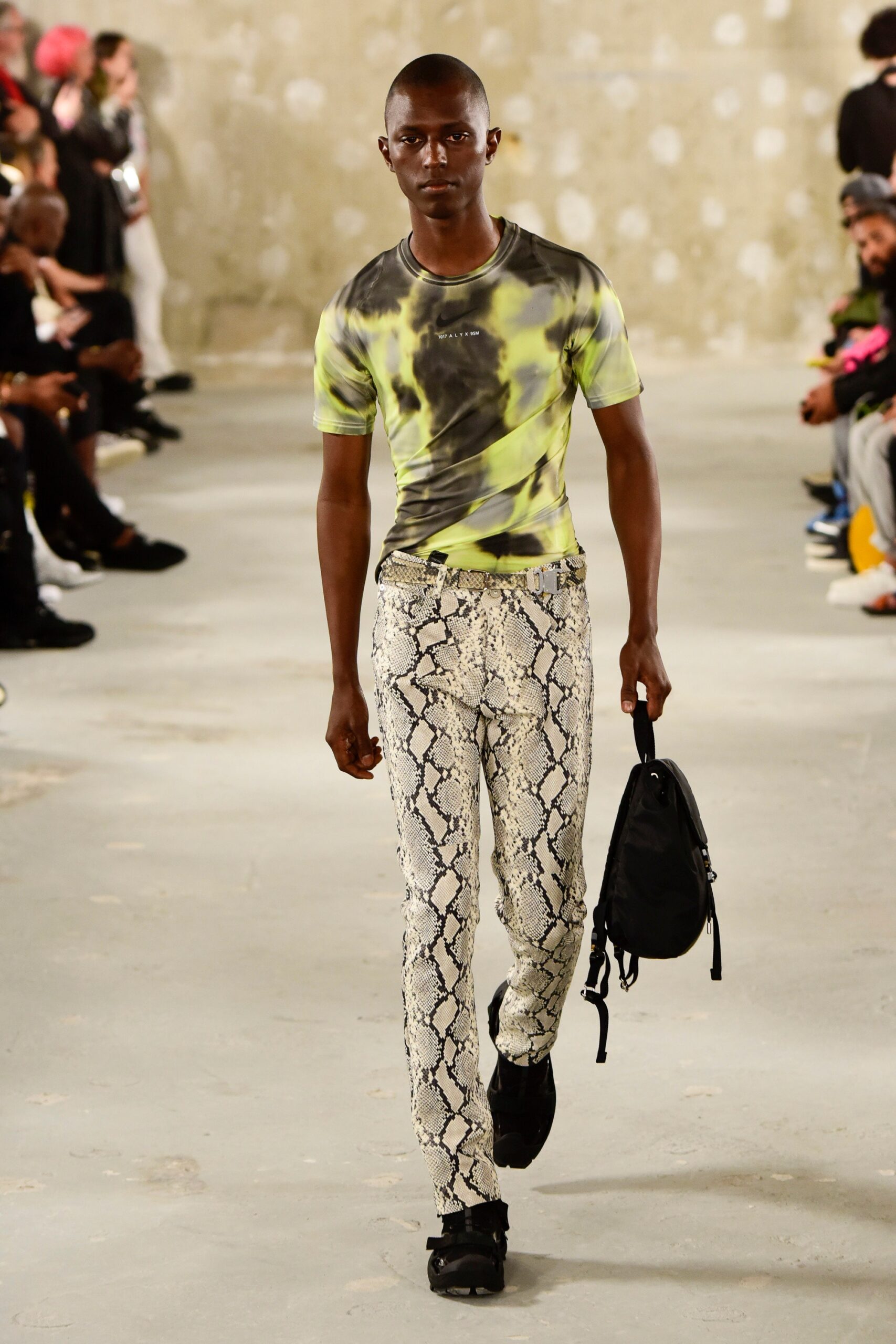 fitted green t-shirt and snake-print pants