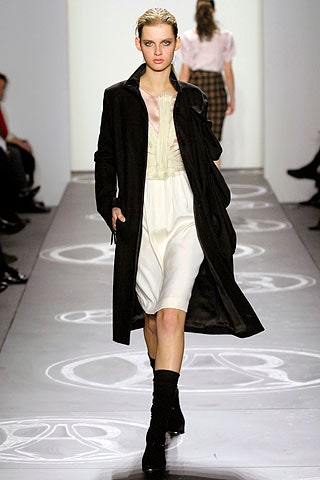black wool coat and white silk dress