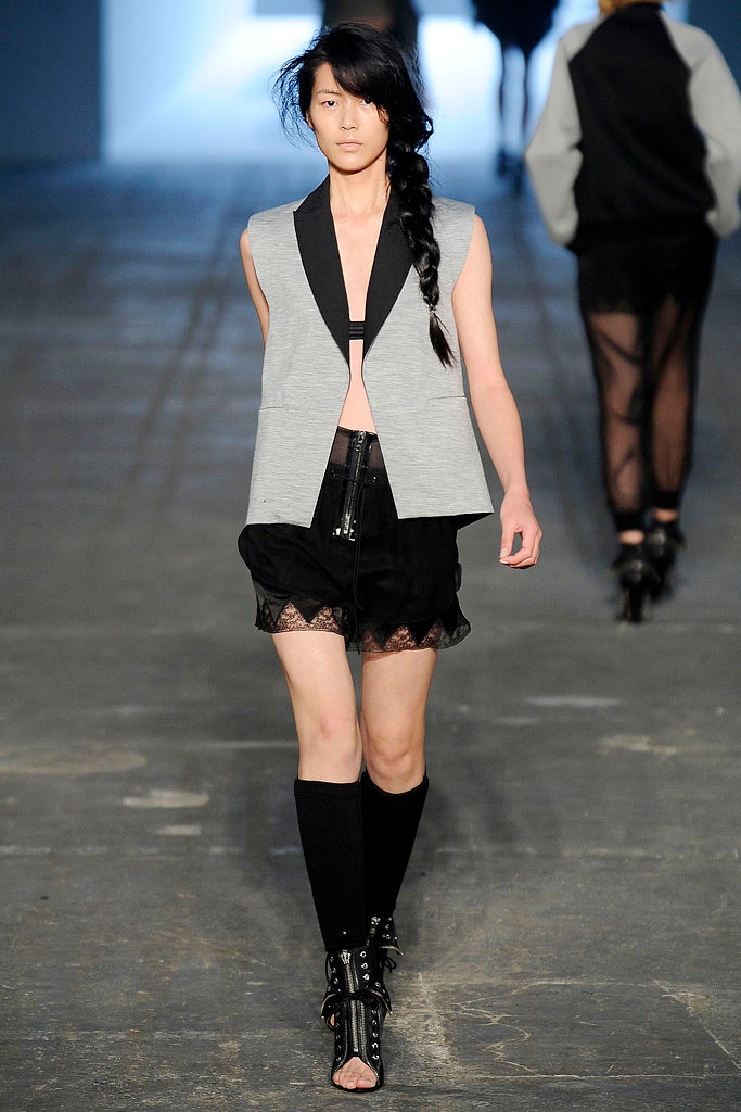 gray vest and black shorts