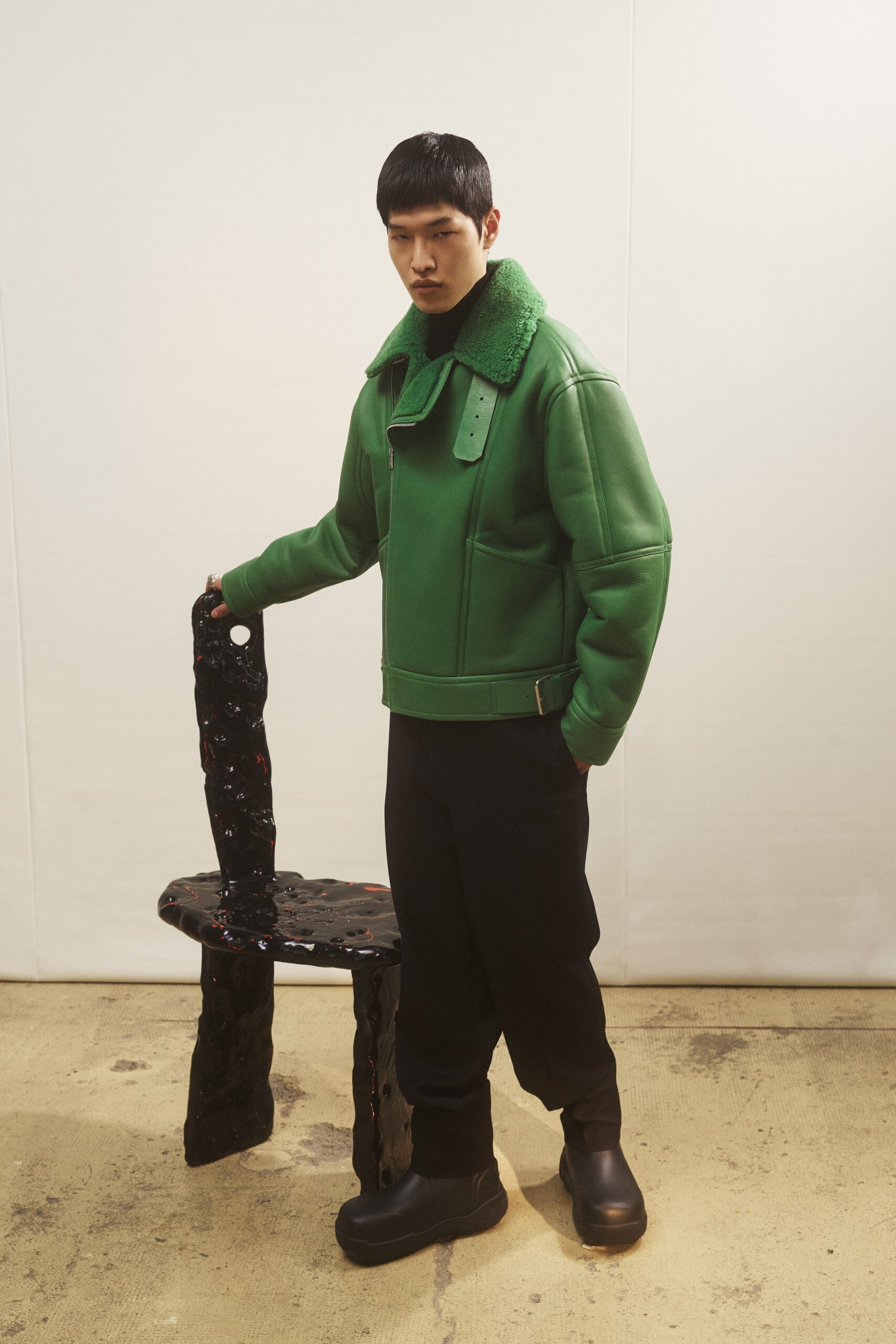 green leather jacket with black pants
