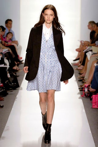 blue and white printed mini dress with black coat