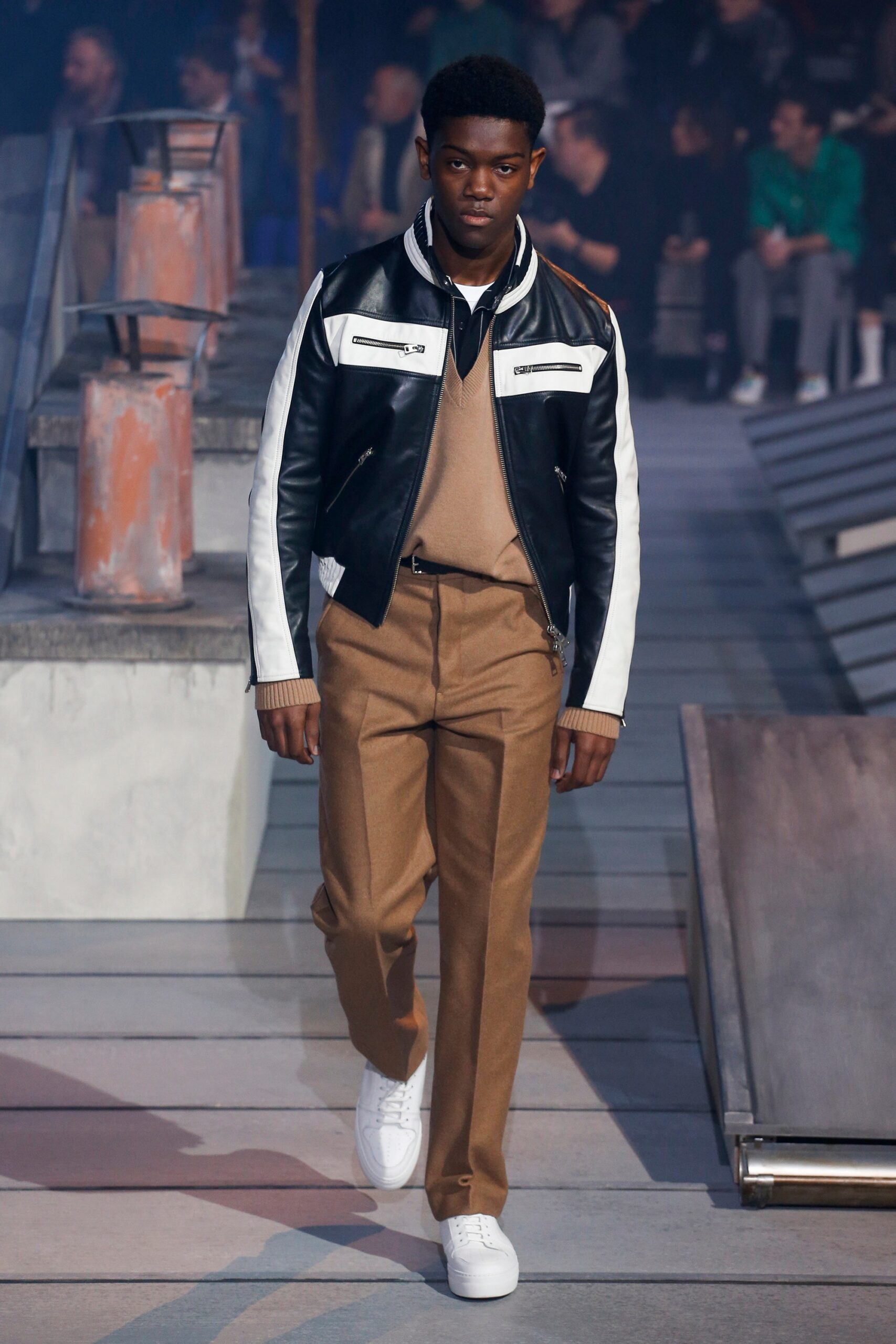 black and white leather jacket with beige sweater