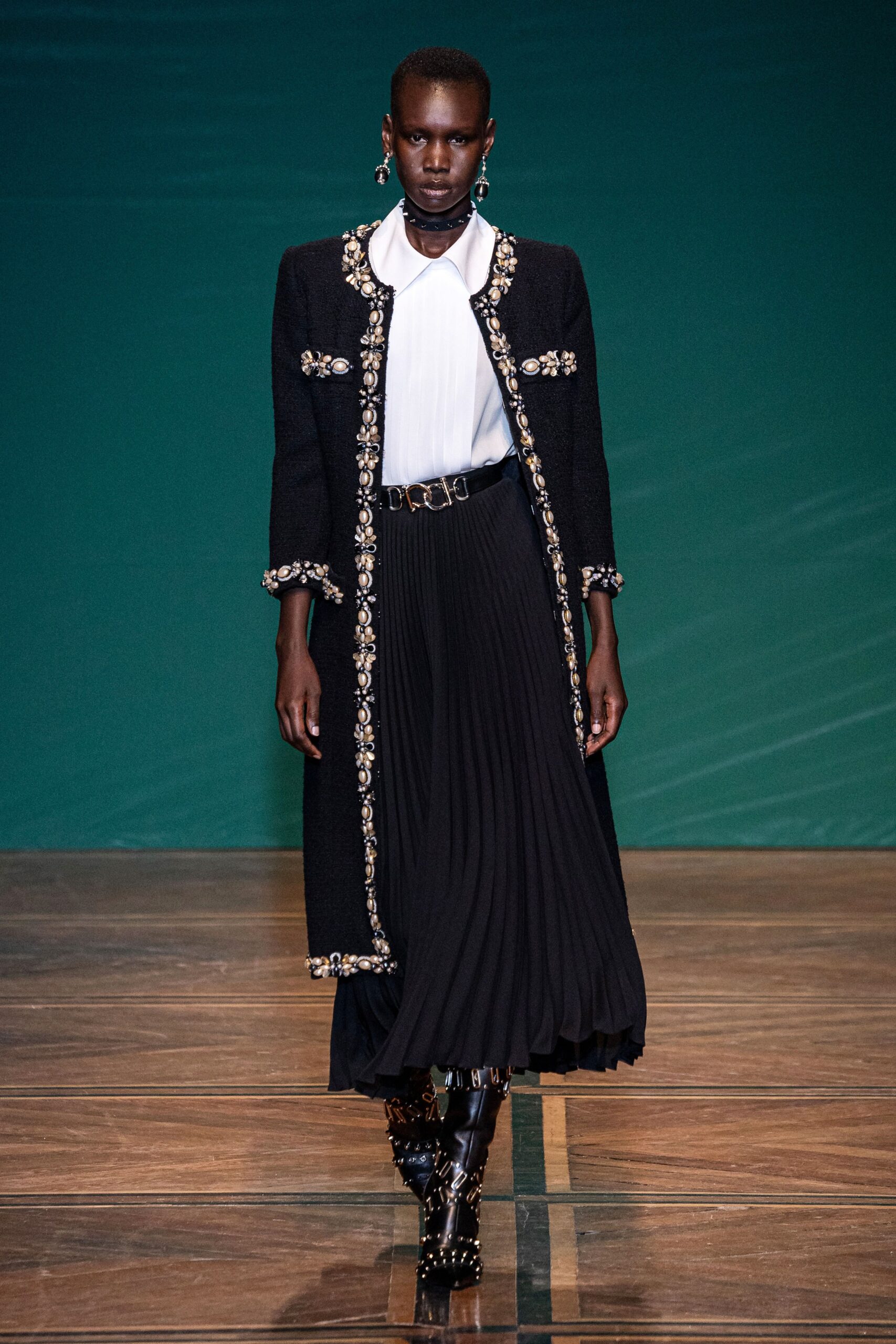black wool coat with embroidered details