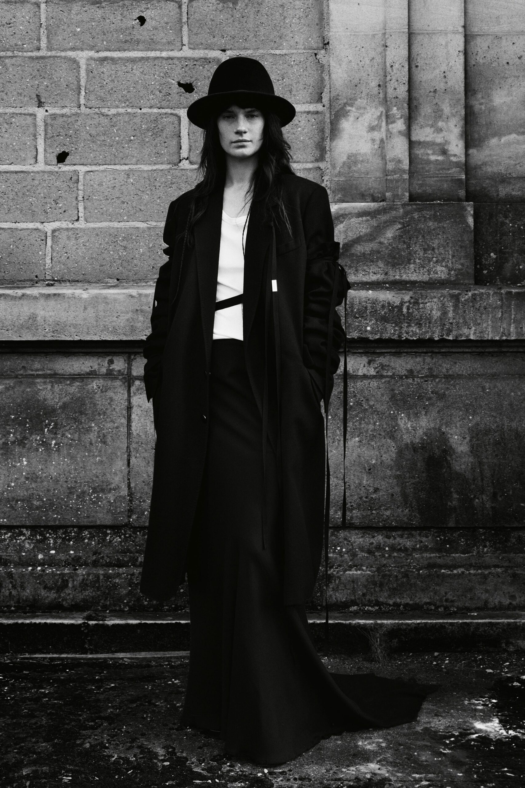 black coat with white top and skirt