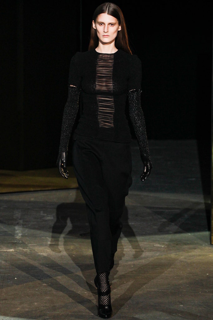 black fitted top and tailored pants