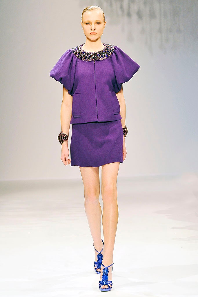 purple fitted jacket and mini skirt
