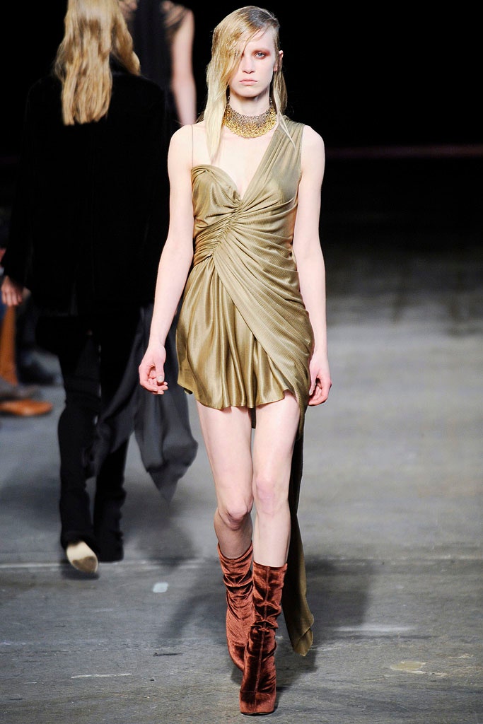 gold draped mini dress with brown boots