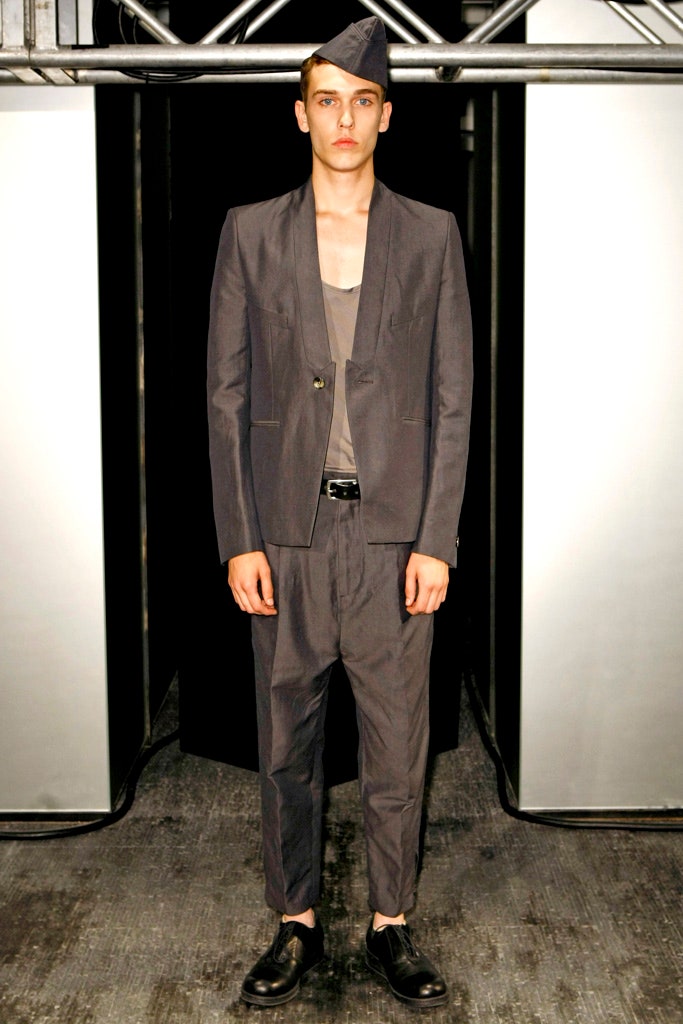 gray tailored suit with sleeveless shirt