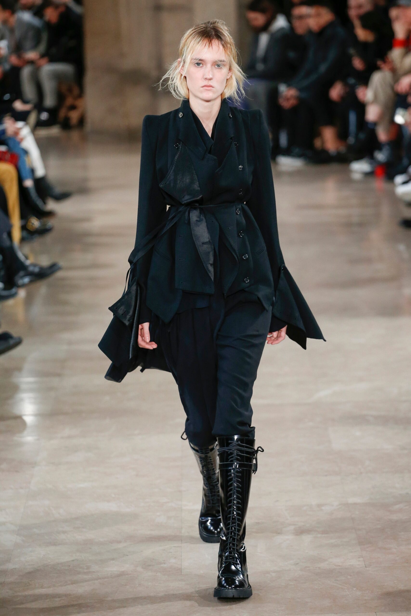 black fitted coat with relaxed pants