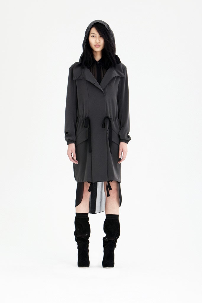 black relaxed trench coat with boots