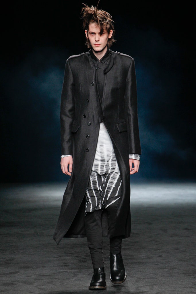 black wool coat with layered shirt