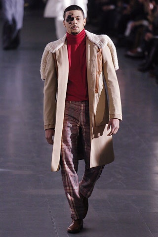 beige coat with red turtleneck