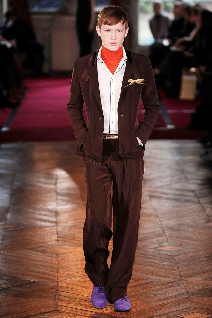 brown tailored suit with red turtleneck