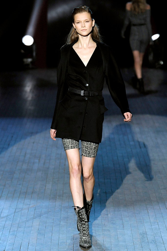 black tailored blazer with gray shorts