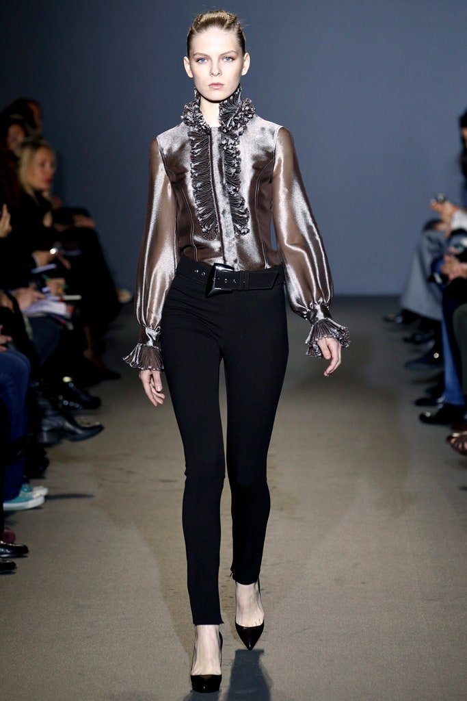 brown silk ruffled blouse with black pants