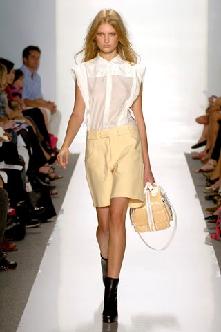 white fitted shirt with beige tailored shorts