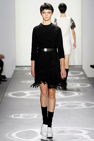 black fitted mini dress with fringe