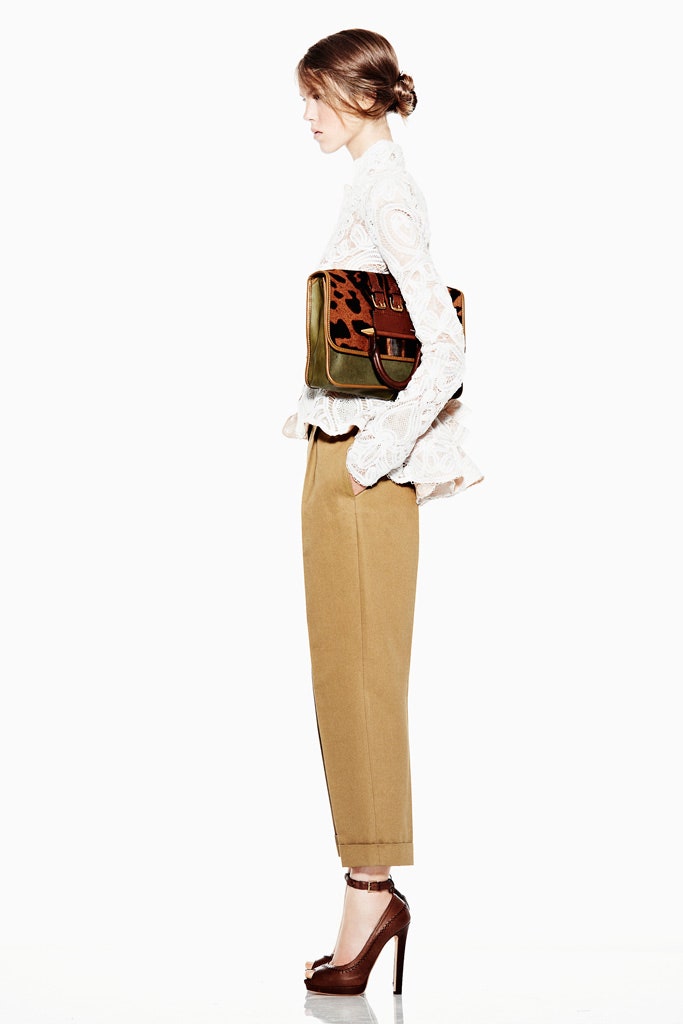 white lace blouse with beige pants