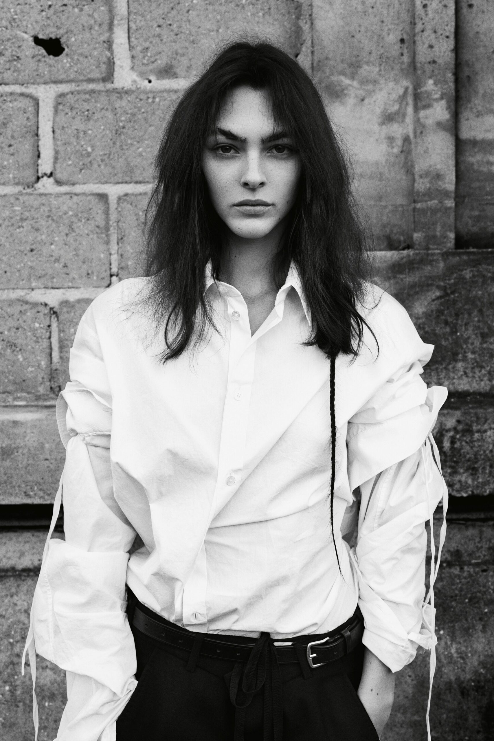 white relaxed shirt and black tailored pants