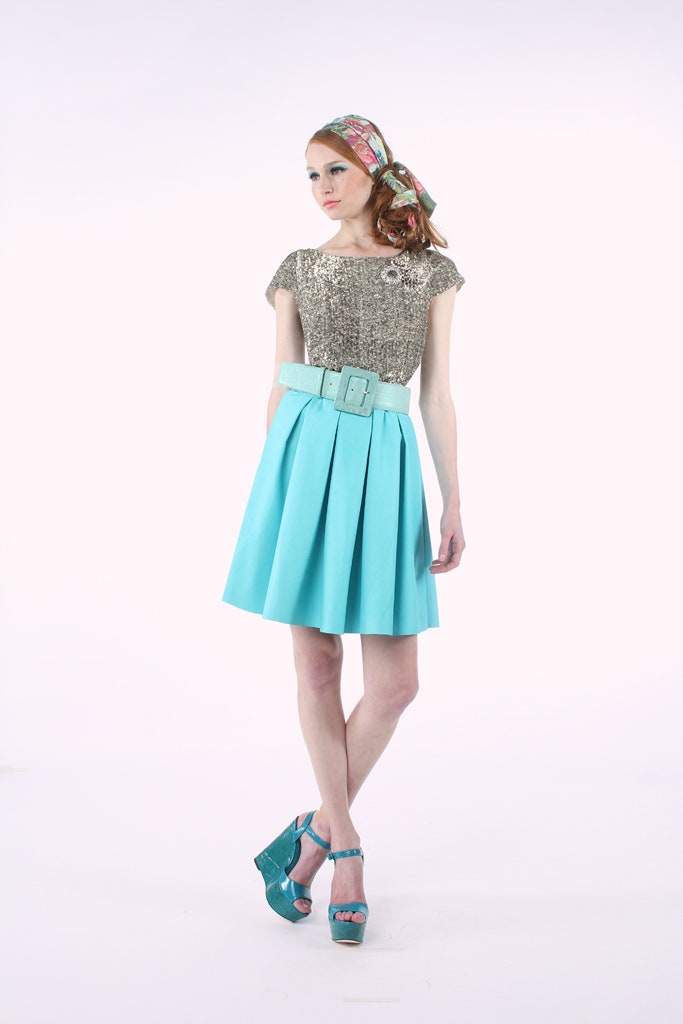 gold sequin top with blue skirt