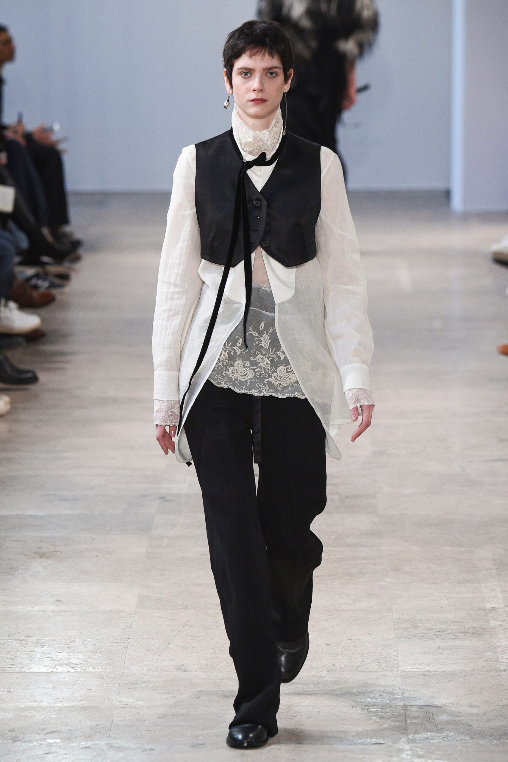 black vest white shirt black pants