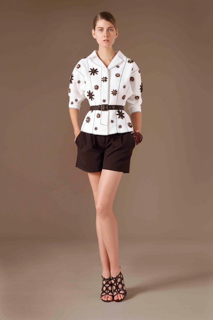white embroidered blouse with black shorts