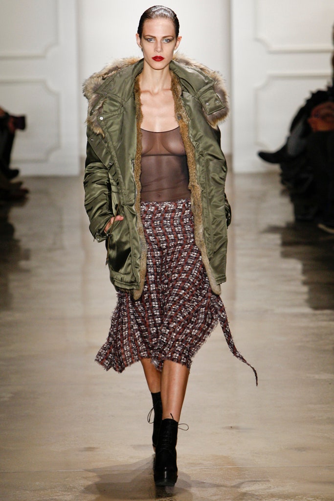 green parka black mesh top brown pleated skirt