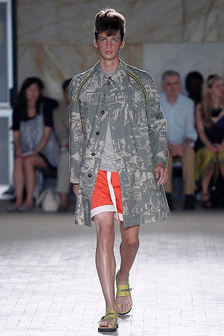 gray printed coat with orange shorts