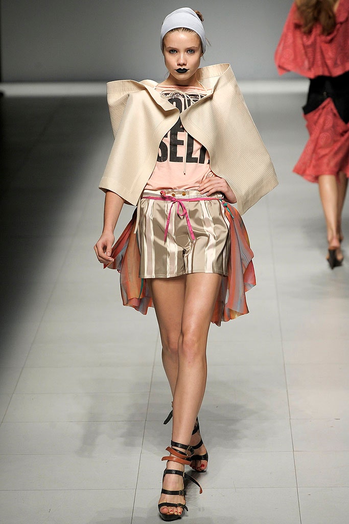 pink fitted top with beige mini skirt