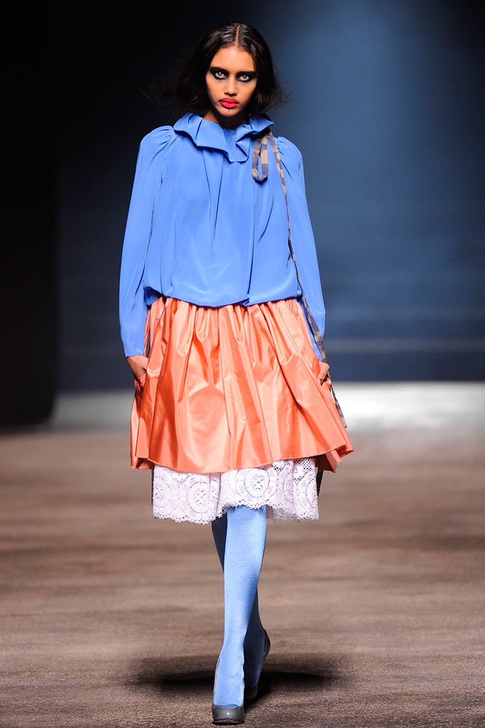 blue silk blouse with orange skirt
