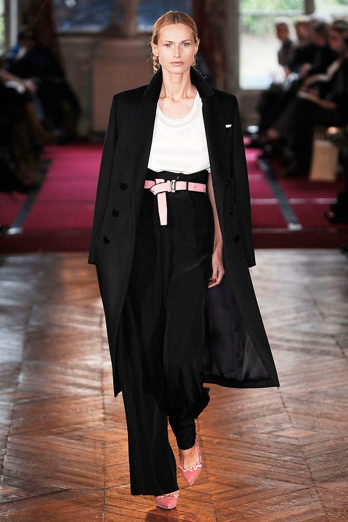 black coat white blouse relaxed pants