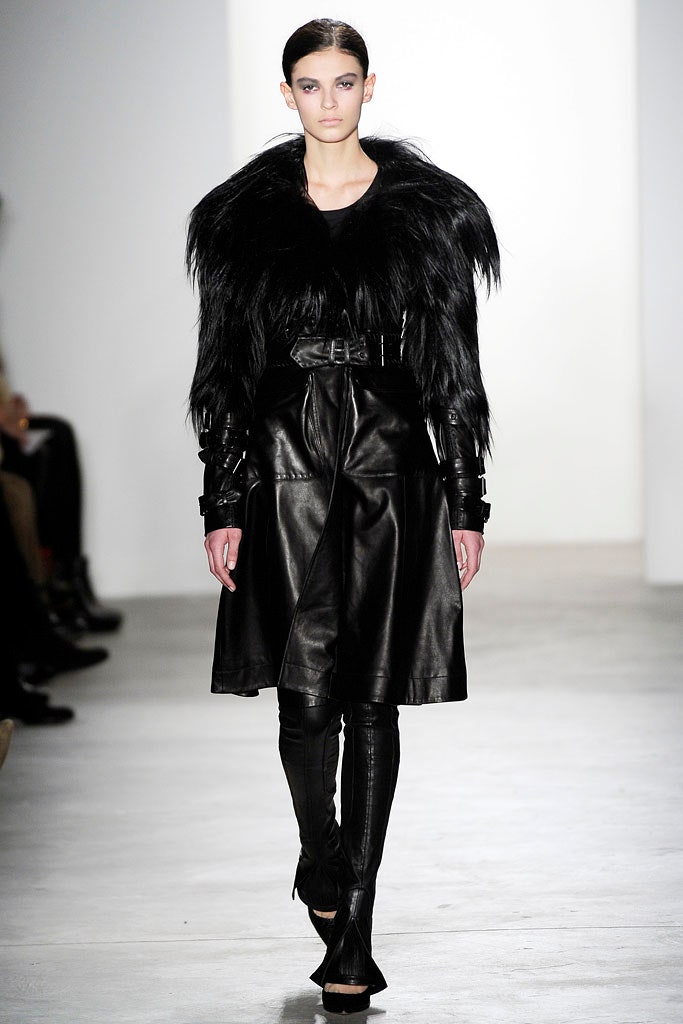 black leather long-sleeve collared fitted belted draped coat
