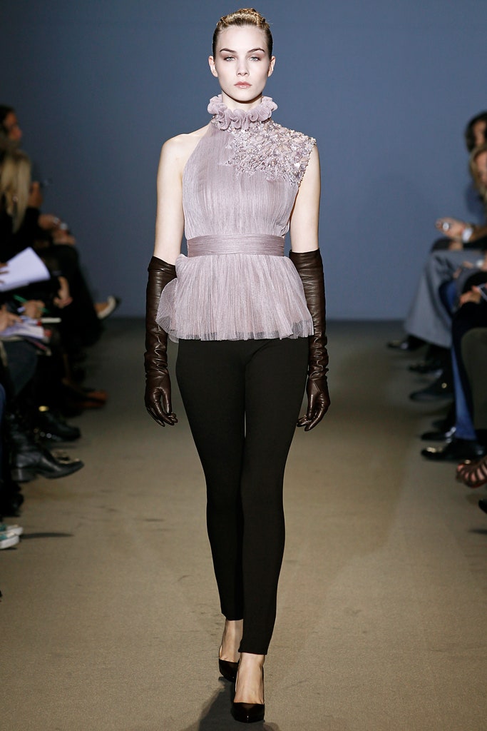 fitted purple pleated top with black pants