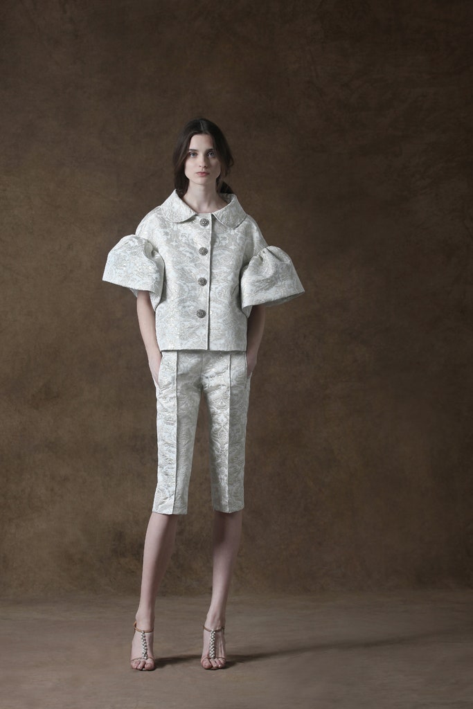 white silk fitted jacket and pants