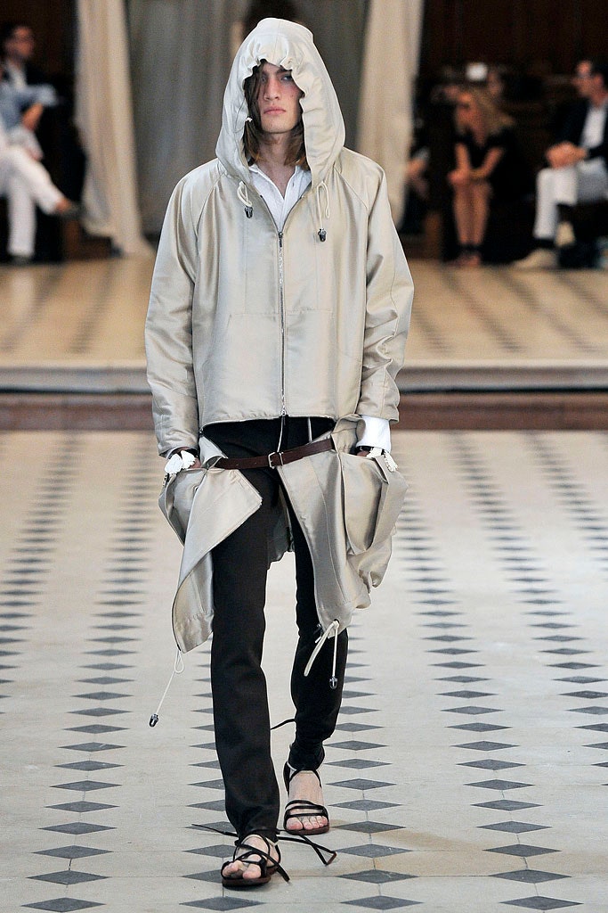 beige hooded jacket with black pants
