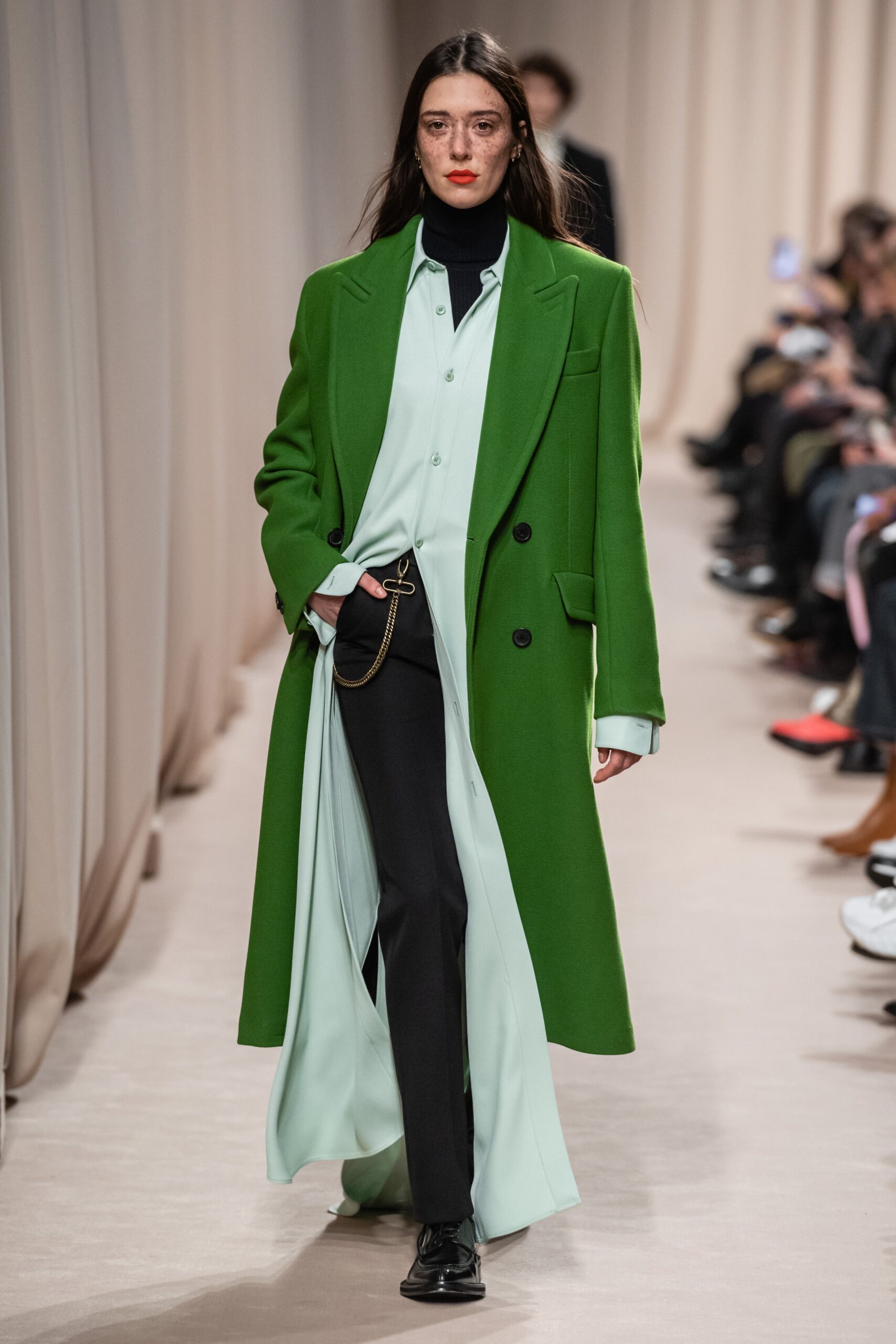 green oversized coat with shirt and pants