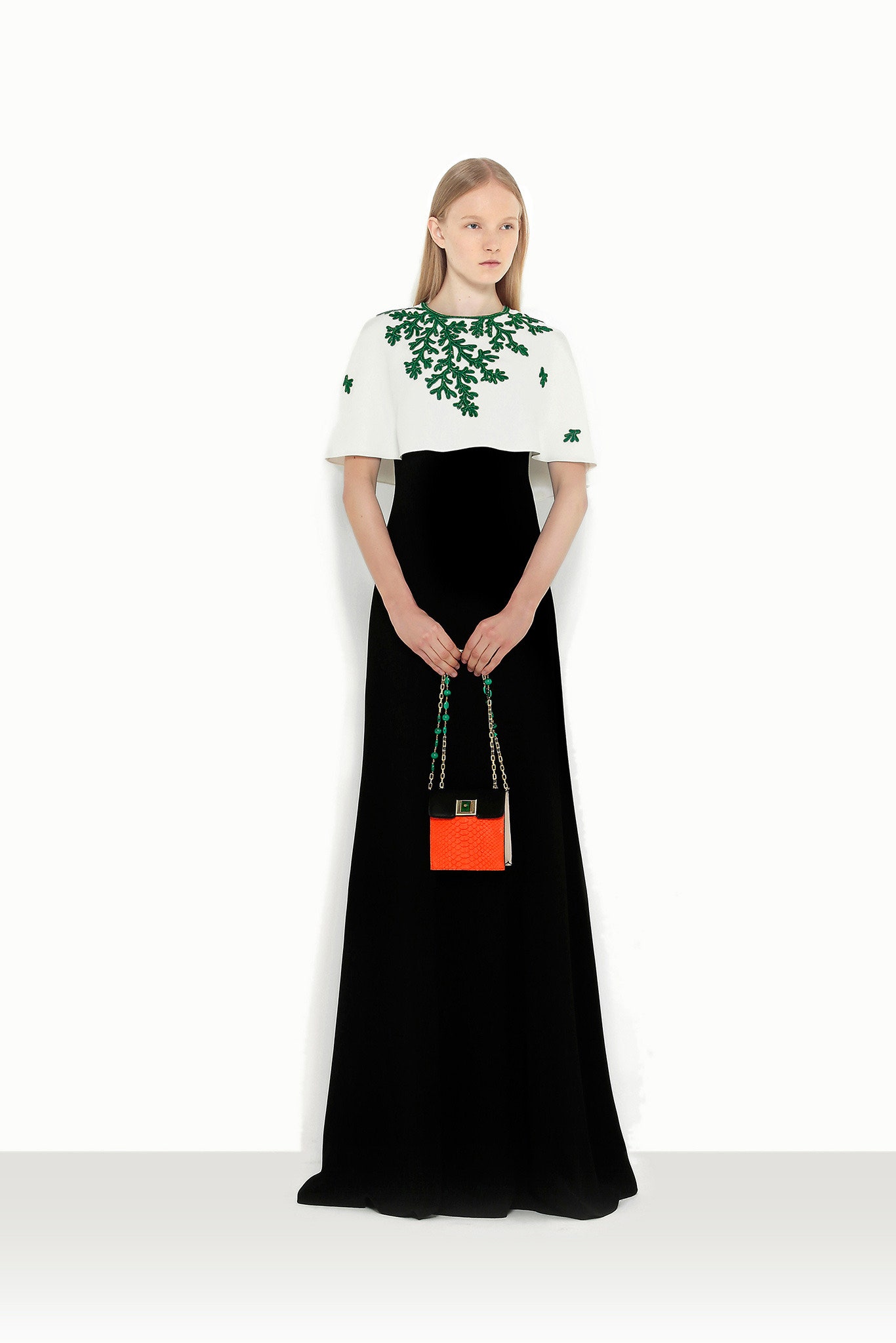 black and white embroidered gown with orange bag
