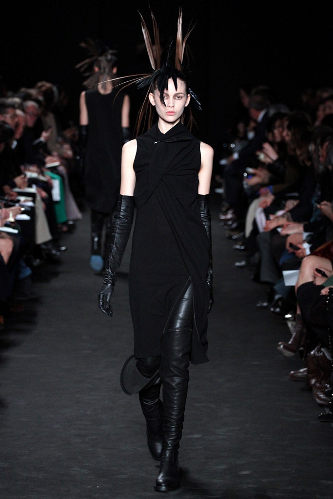 black fitted midi dress with gloves and boots