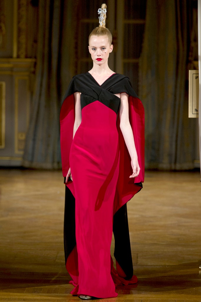 red and black draped gown