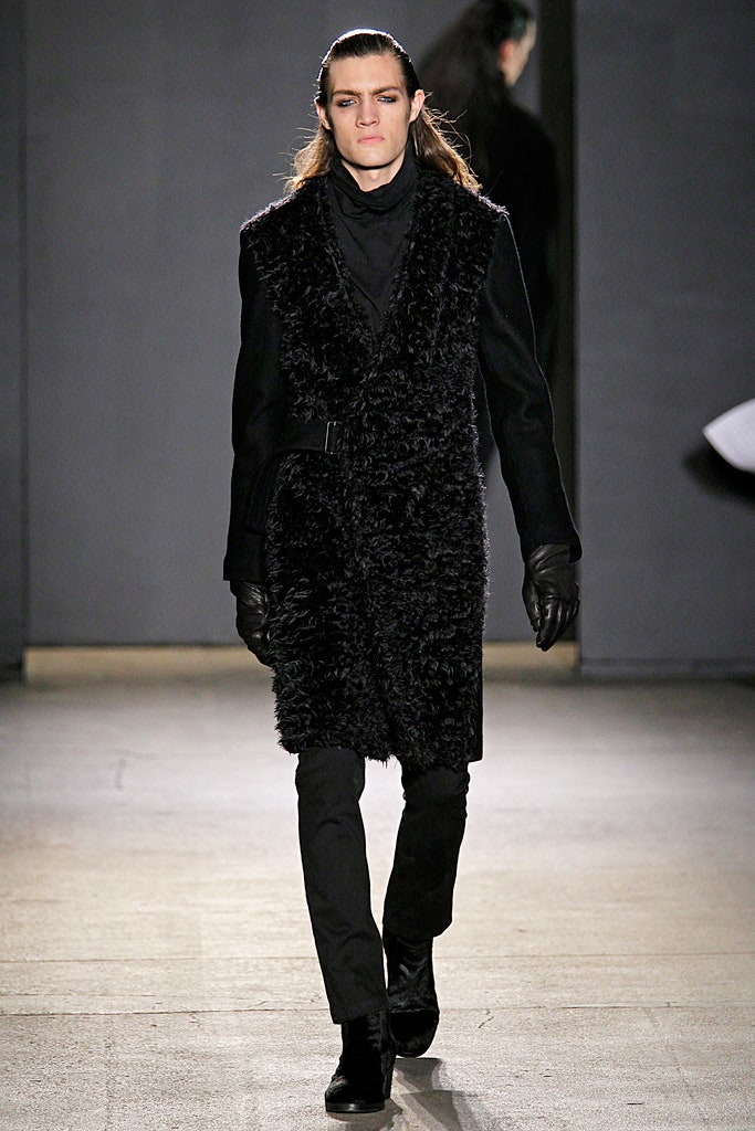 black faux-fur coat with slim pants