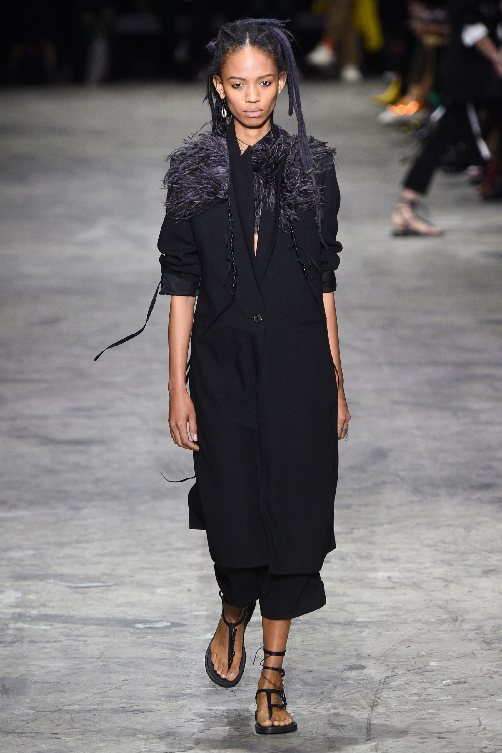 black fitted coat with relaxed pants