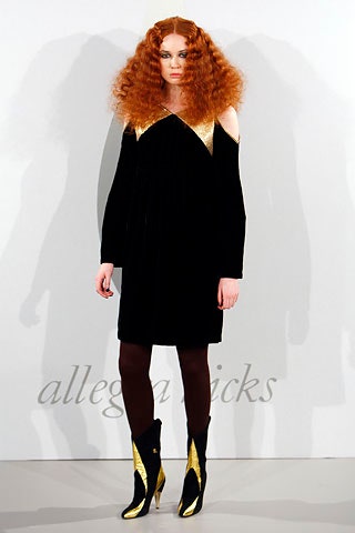 black velvet off-shoulder dress with gold boots